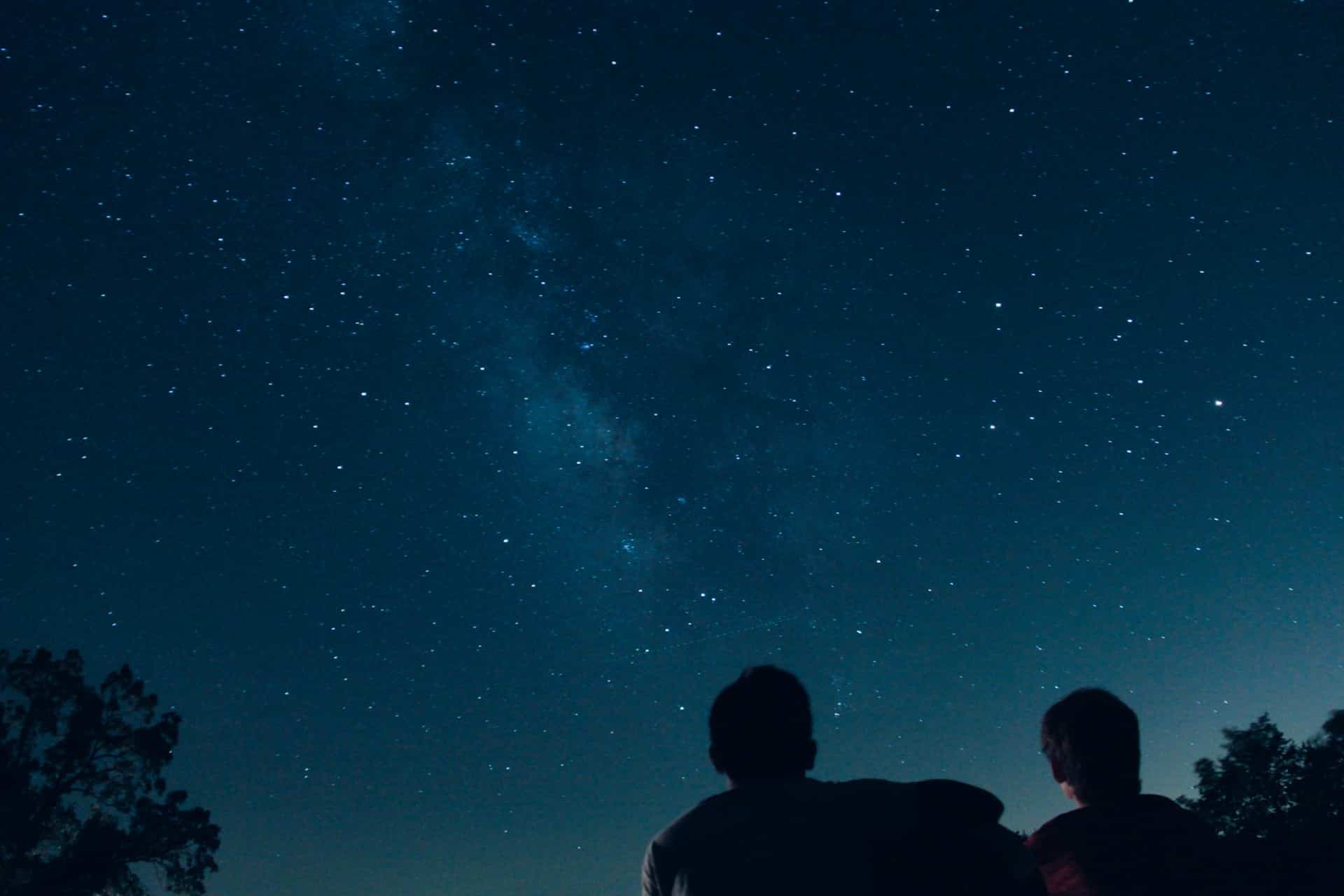 a father and son stargazing