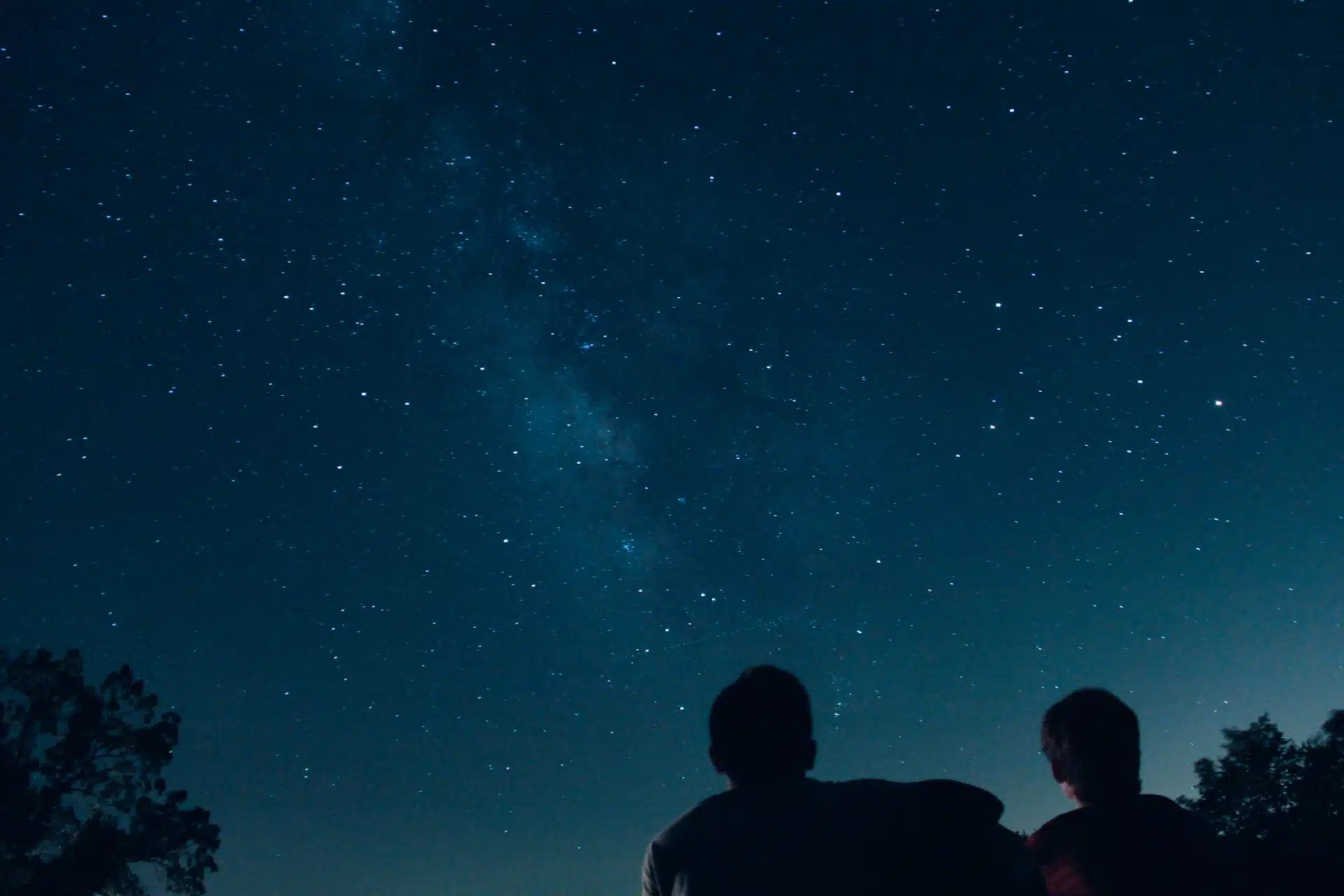 a father and son stargazing