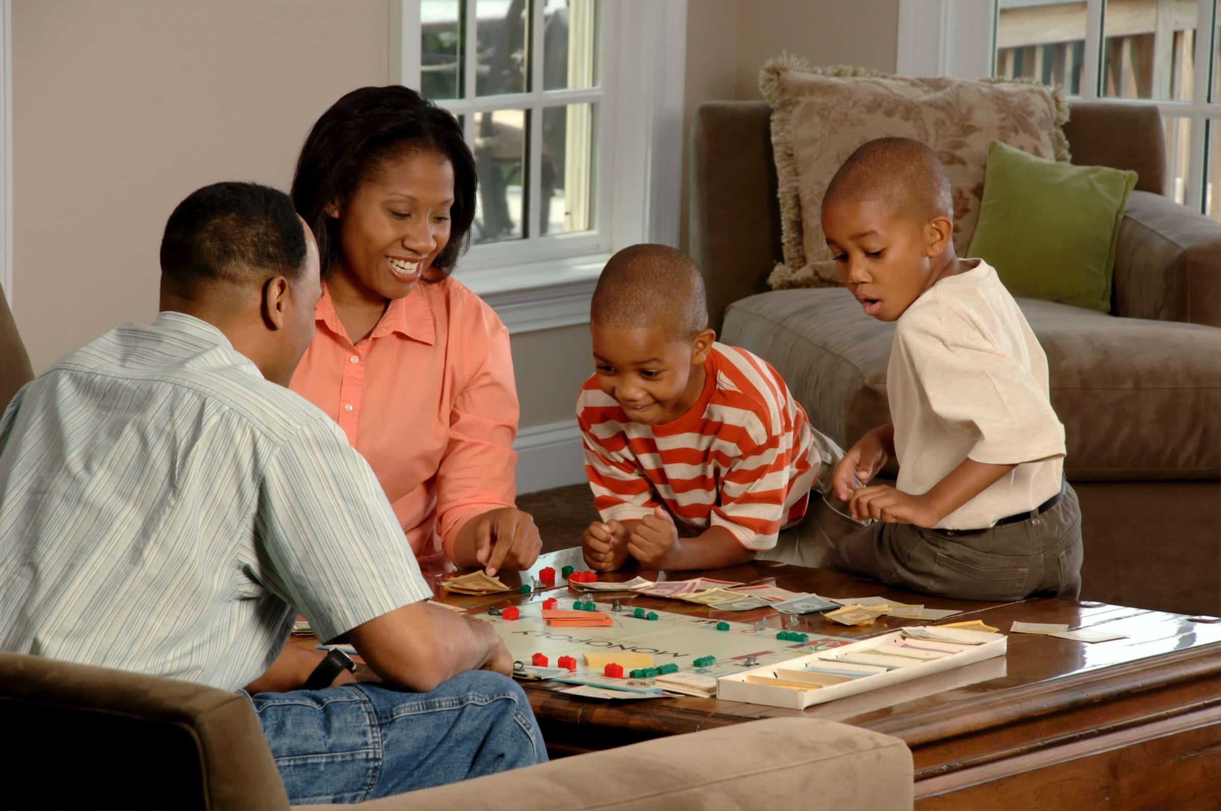 a family playing Monopoly