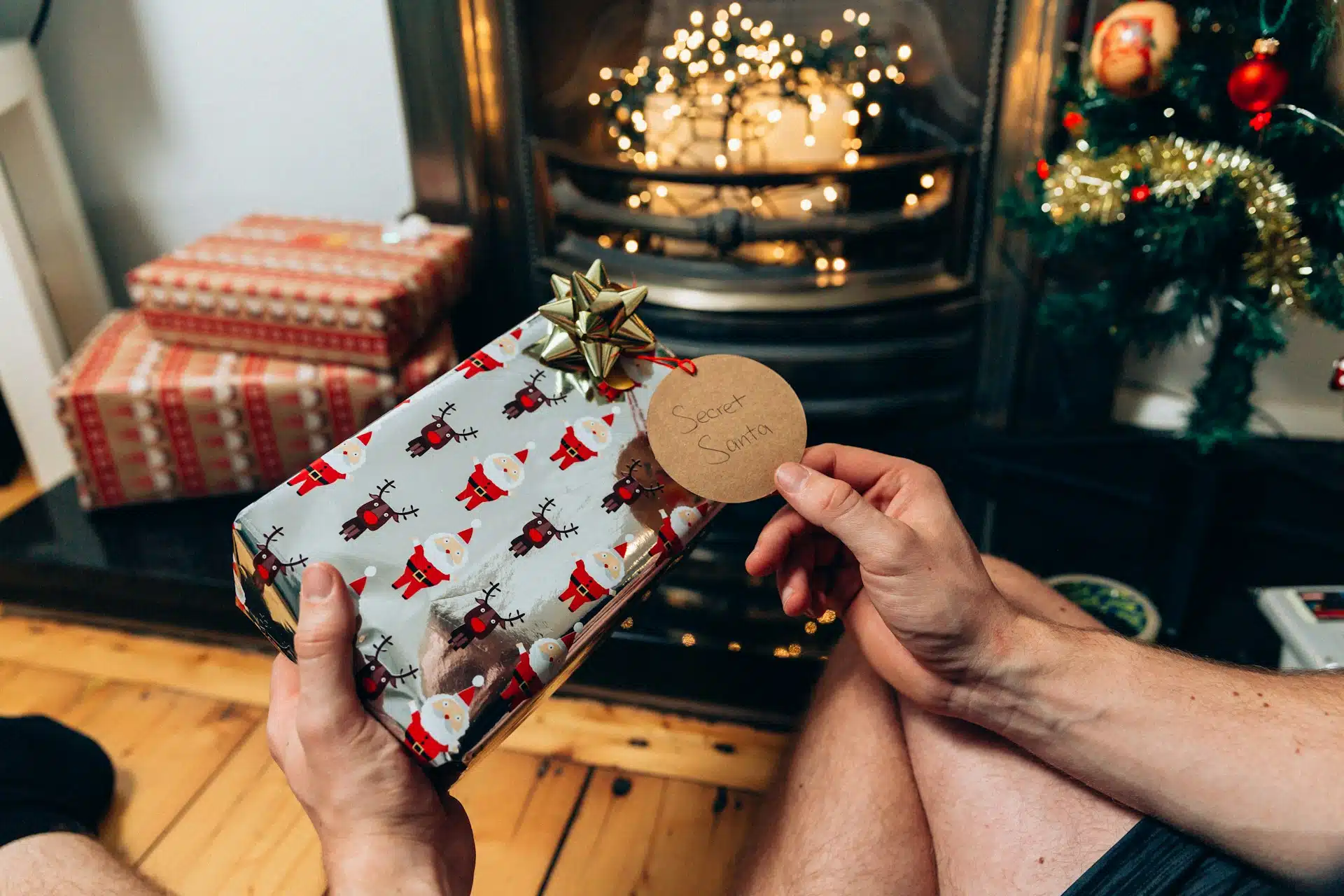 a dad opening a Secret Santa Christmas present