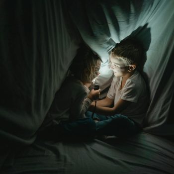 Two kids hiding out during a storm