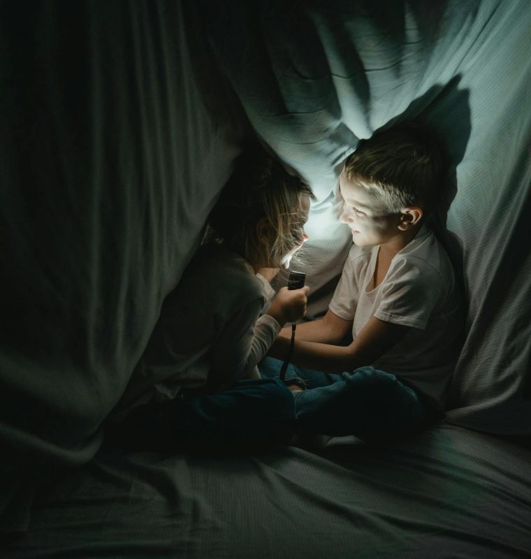 Two kids hiding out during a storm